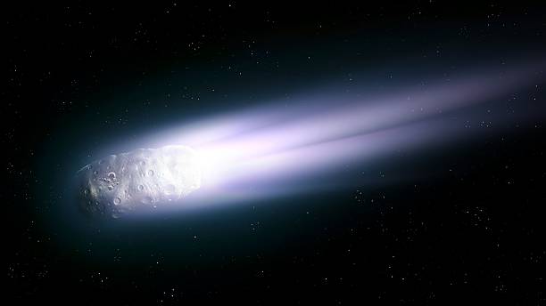 istock A comet with a gas and dust tail in space. Bright celestial body. 2238523428