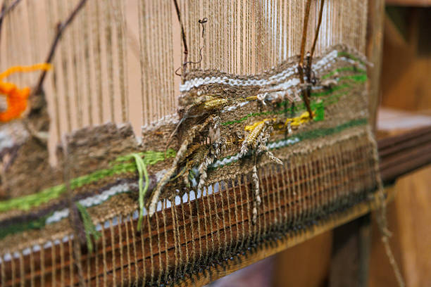 This image showcases a detailed woven tapestry featuring various textures and colors, emphasizing the natural materials used, reflecting a blend of craftsmanship and artistic expression.