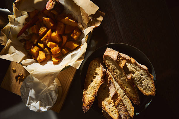 Golden Crusty Bread Slices With Roasted Potatoes Served On Rustic Table For Comfort Meal