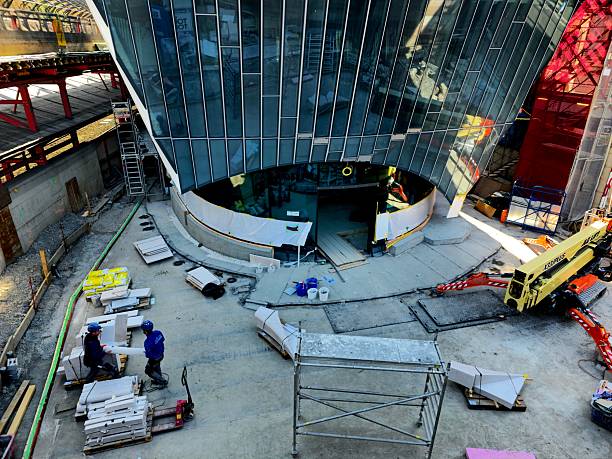 The new “Haus zum Falken” commercial building is located next to Zurich Stadelhofen Train Station and provides direct access to the platform. The image shows the construction site in Zurich, captured during spring season.