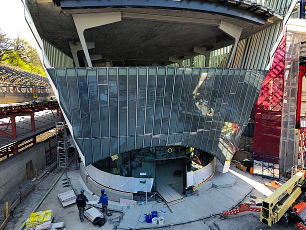 The new “Haus zum Falken” commercial building is located next to Zurich Stadelhofen Train Station and provides direct access to the platform. The image shows the construction site in Zurich, captured during spring season.