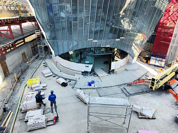 The new “Haus zum Falken” commercial building is located next to Zurich Stadelhofen Train Station and provides direct access to the platform. The image shows the construction site in Zurich, captured during spring season.