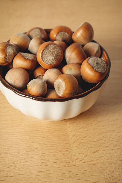 istock Bowl of fresh hazelnuts ready for snacking or baking delight 2238532046