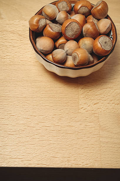istock Freshly harvested hazelnuts in a decorative bowl ready for snacking 2238532051