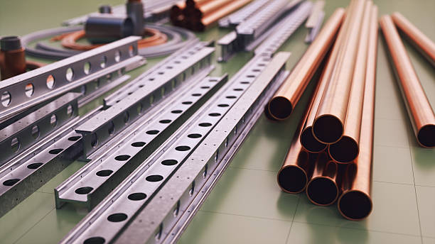 Steel and copper construction material parts, low angle view.