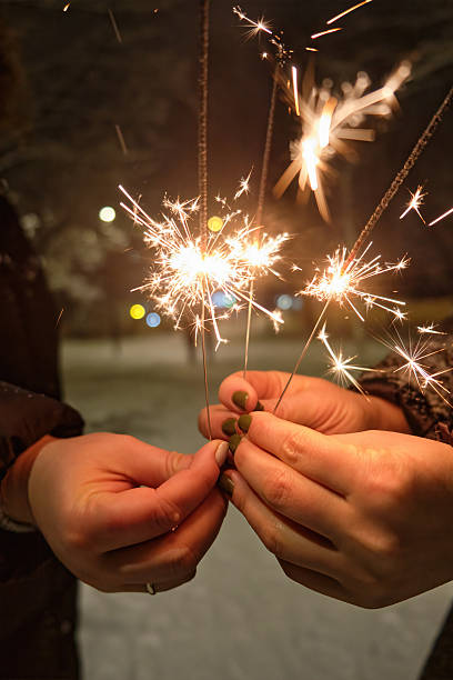 istock Christmas and happy new year sparkler in hand 2238538404