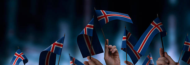 istock Iceland flags in their hands on a blurred urban background 2238540676