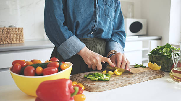 istock Woman Cutting Yellow Pepper 2238545495