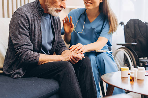 istock Nurse caring for senior man at home 2238545647