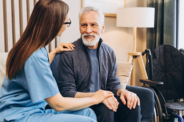 istock Nurse supporting senior man at home care 2238545680