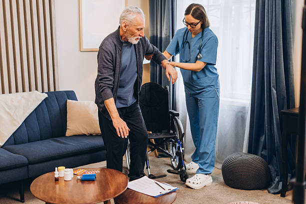 istock Nurse assisting senior man transfer from wheelchair 2238545693
