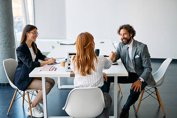 istock Business people shaking hands celebrating partnership in office meeting 2238546777