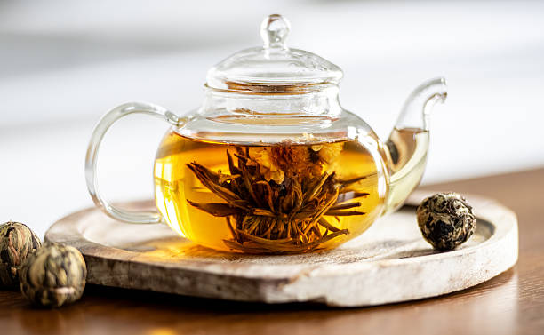 Clear Teapot With Tied Green Tea