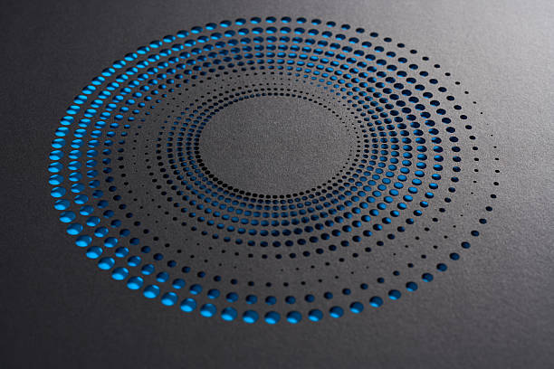 istock Radial spiral of blue gradient dots cut into black paper with layered depth 2238549051
