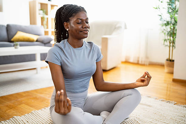istock Young black woman practicing yoga indoors 2238550376