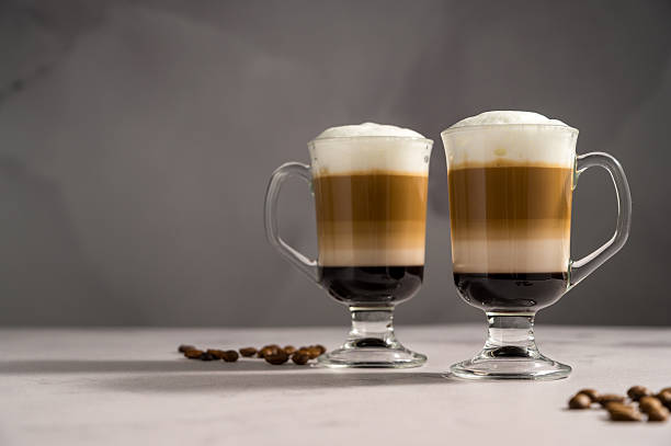 istock Layered coffee latte drinks. Hot coffee drinks in glass mugs 2238550861