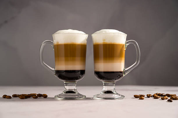 istock Layered coffee latte drinks. Hot coffee drinks in glass mugs 2238550883