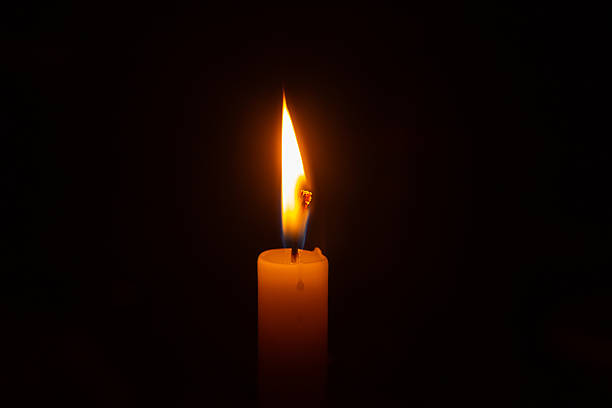 istock Close up of a lit candle flame. 2238551049