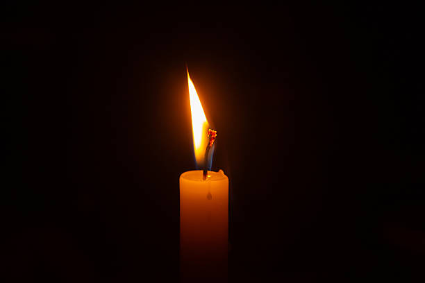 istock Close up of a lit candle flame. 2238551052