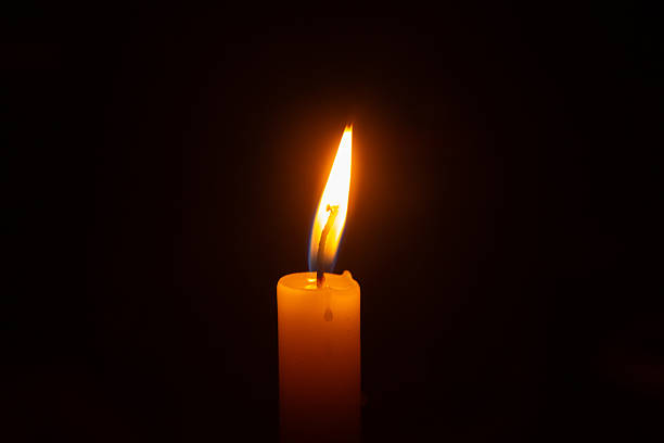 istock Close up of a lit candle flame. 2238551053