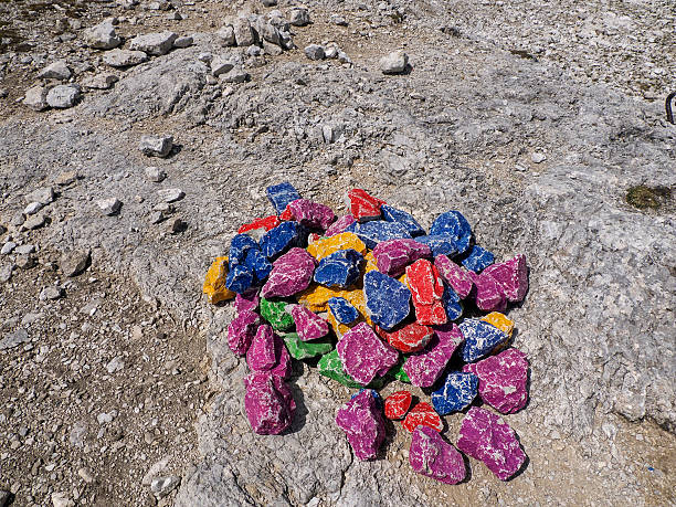 peace rainbow stones in dolomites mountains