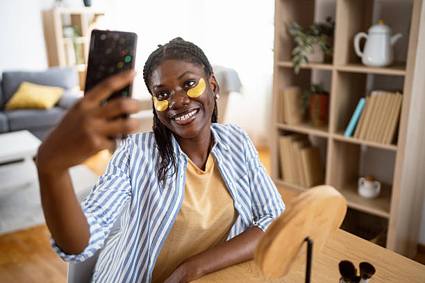 istock Confident black woman taking a selfie during her beauty routine 2238551223