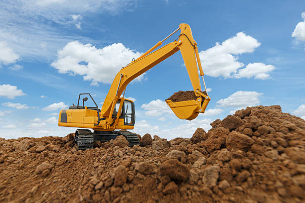 istock Excavator  are digging  soil in the construction site . 2238551545
