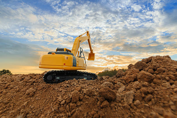 istock Excavators  are digging soil with  in the construction site . 2238551682