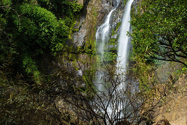 istock Waterfall in green tropical deep forest rainy season 2238551977