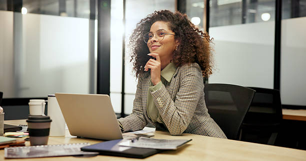 istock Night, thinking and woman in office, laptop and editor with article publication, internet and ideas. Evening, person and journalist with pc, positive review and choice with inspiration and decision 2238552617