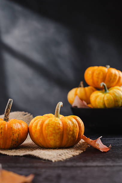 istock Group of orange pumpkins on bright background, abstract autumn, concept 2238553829