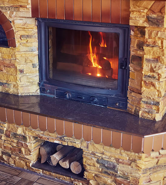 istock fireplace with burning firewood and fire 2238555150