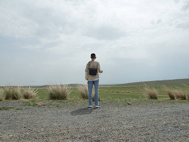 boy wearing fpv goggles piloting drone outdoors