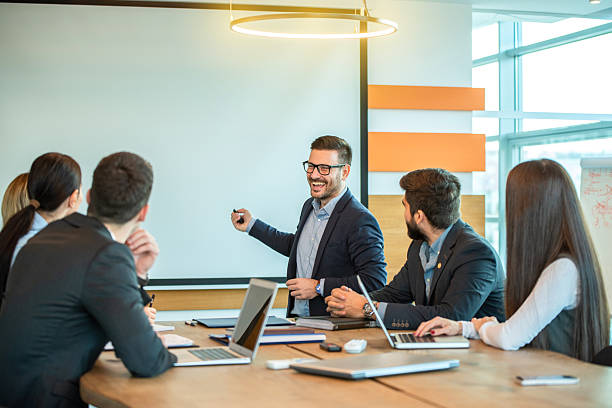 istock Executive business leader presenting strategic insights to engaged corporate team 2238556295