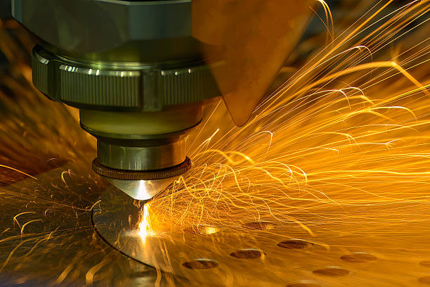istock Close up scene the fiber laser cutting machine cut the metal plate control by CNC program. 2238557372