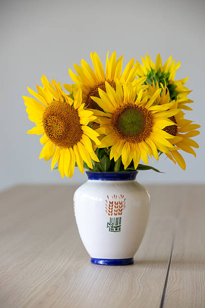 istock A bouquet of sunflowers presented in a ceramic vase. 2238559374