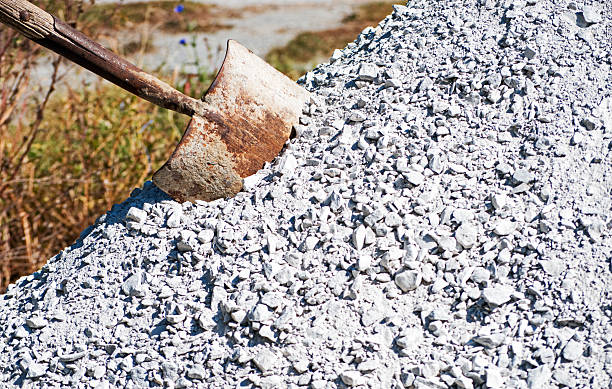 istock Shovel imbedded in white stones 2238559440