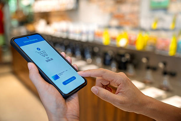 istock Person making online shopping payment using smartphone 2238559703
