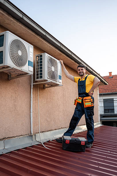 istock Skilled technician performs maintenance on air conditioning units atop a residential building 2238560665