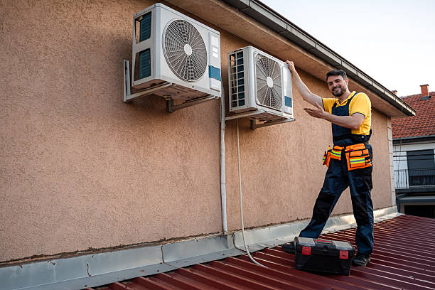 istock Technician performs maintenance on air conditioning units on a residential rooftop in summer 2238560703