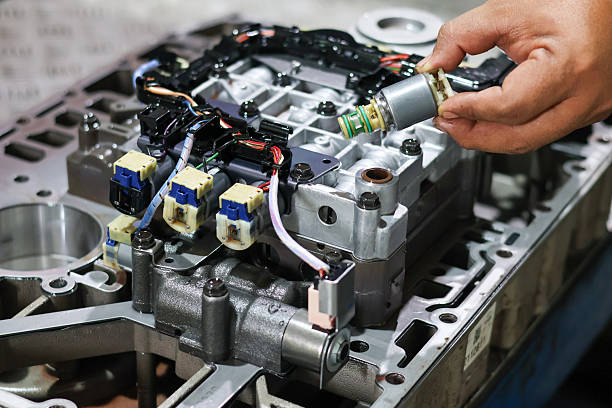 istock A mechanic's hand is carefully installing a solenoid valve 2238562568