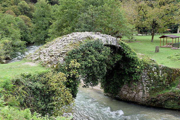 Old medieval ruined stone bridge in Abkhazia