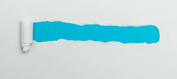 istock Tear open the white paper on the blue paper 2238569713