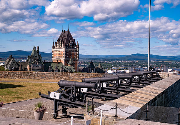 Historic, non-functioning canons line the walls of the historic citadel overlooking the Saint Lawrence River in Quebec City.