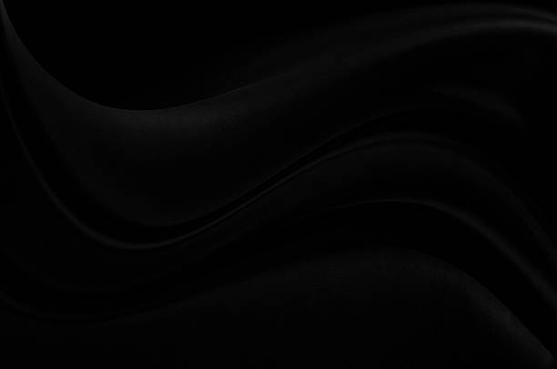 istock Black gray satin dark fabric texture luxurious shiny that is abstract silk cloth background with patterns soft waves blur beautiful. 2238574033