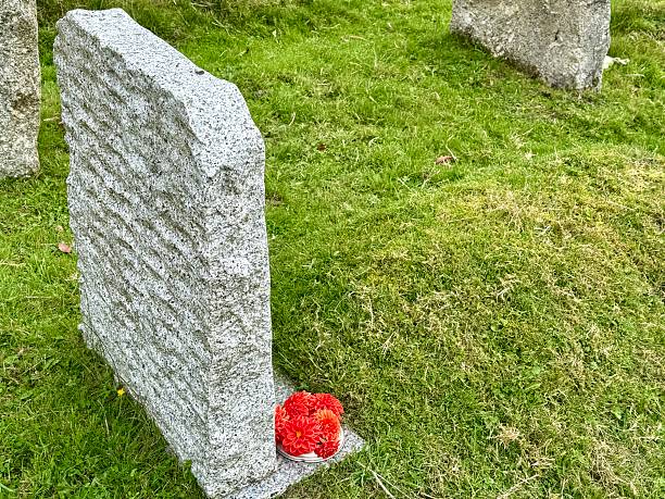 Gravestone with floral tributes