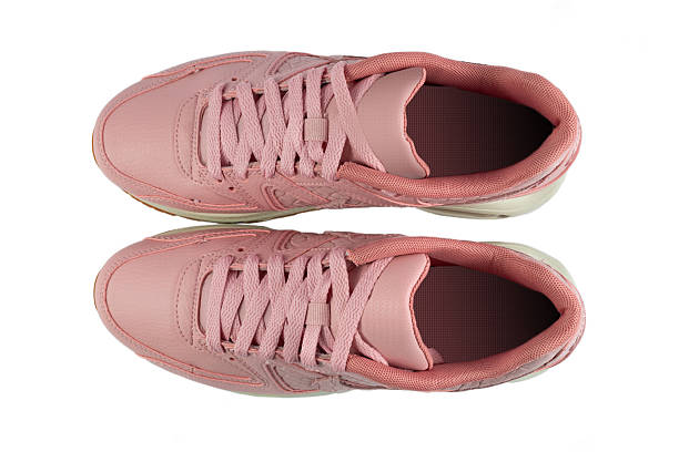 istock Pair of woman's sneakers isolated from background. 2238575615