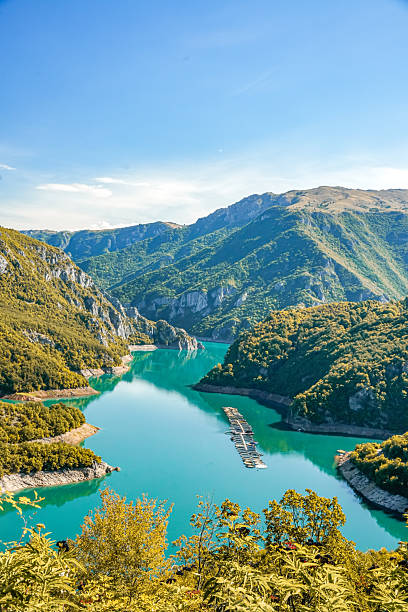 istock Piva Lake surrounded by mountains 2238580324