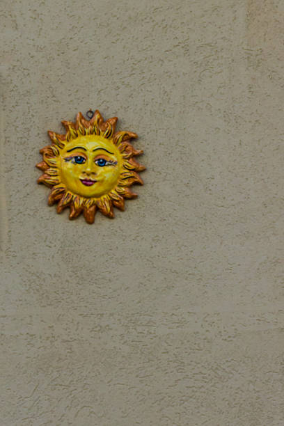 istock Cheerful Sun Face Wall Ornament Decor Mounted on Textured Beige Wall 2238580453