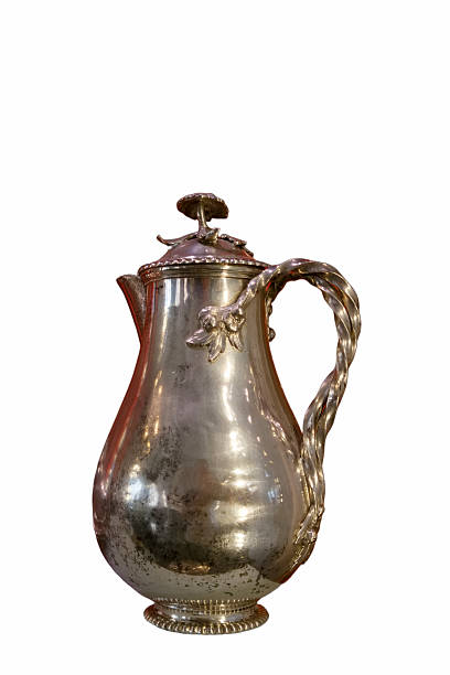 istock Elegant silver pitcher with intricate design displayed on a neutral background 2238581343